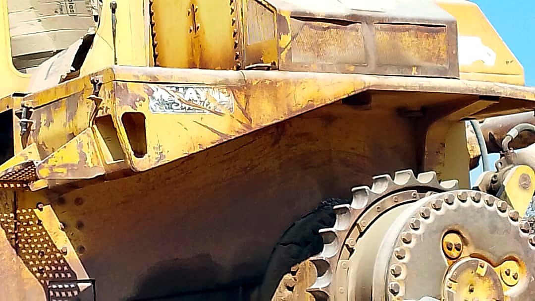 Close view of the bulldozer elevated sprocket and bodywork